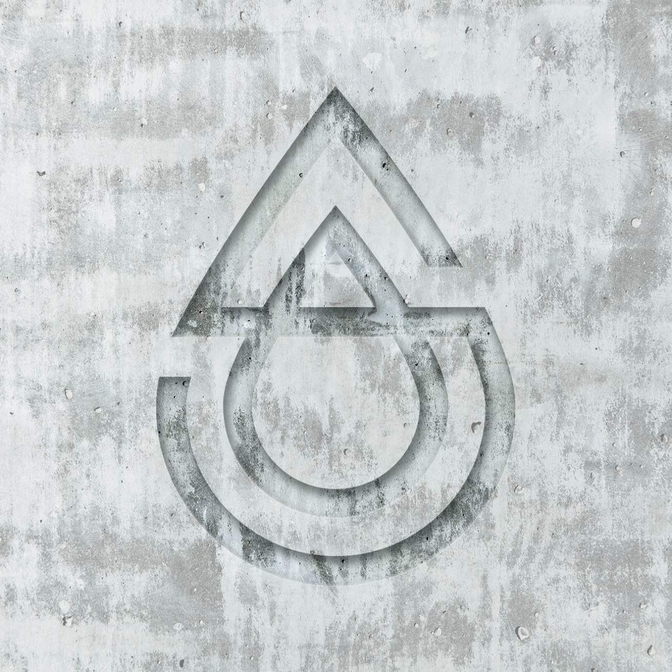 A water drop logo on a concrete wall.